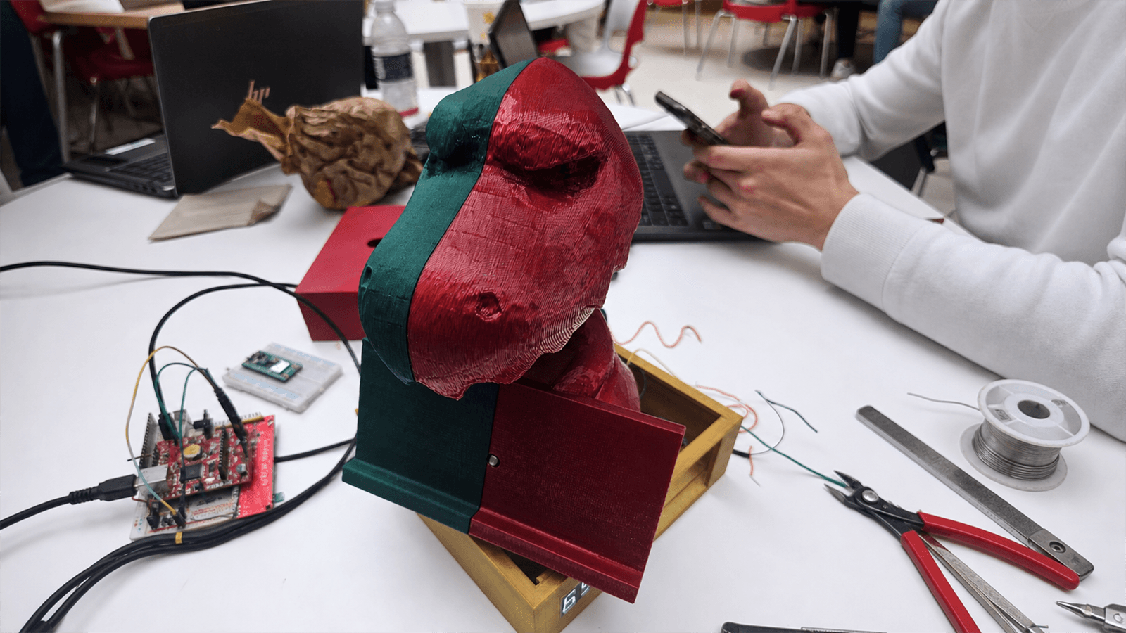 Three-dimensional printed voice-enabled study desk companion with a phone rest and display enclosure